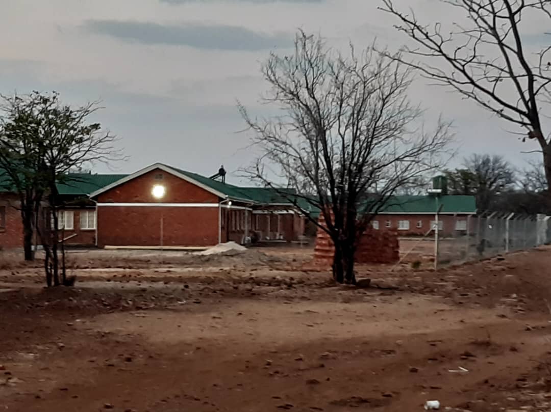 Nurses' house with green roof at dusk